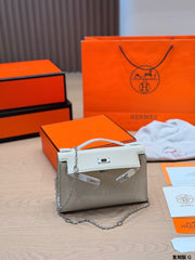 Classic Kelly clutch with silver buckle, upgraded with Swift leather.