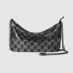 Metallic evening bag with charm