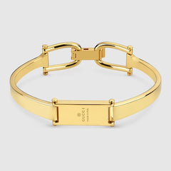 Stirrup motif bangle bracelet - gold-toned brass